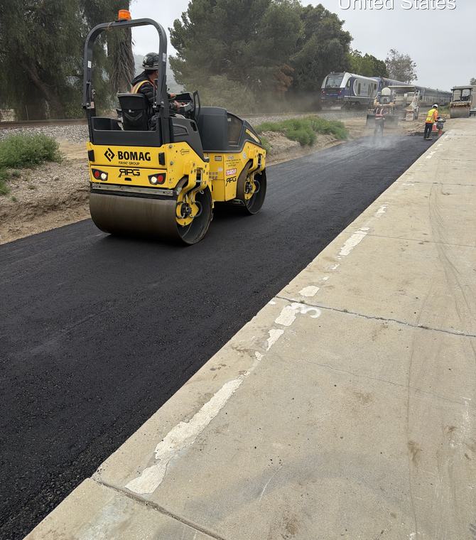 Roller compacting fresh asphalt on a residential street