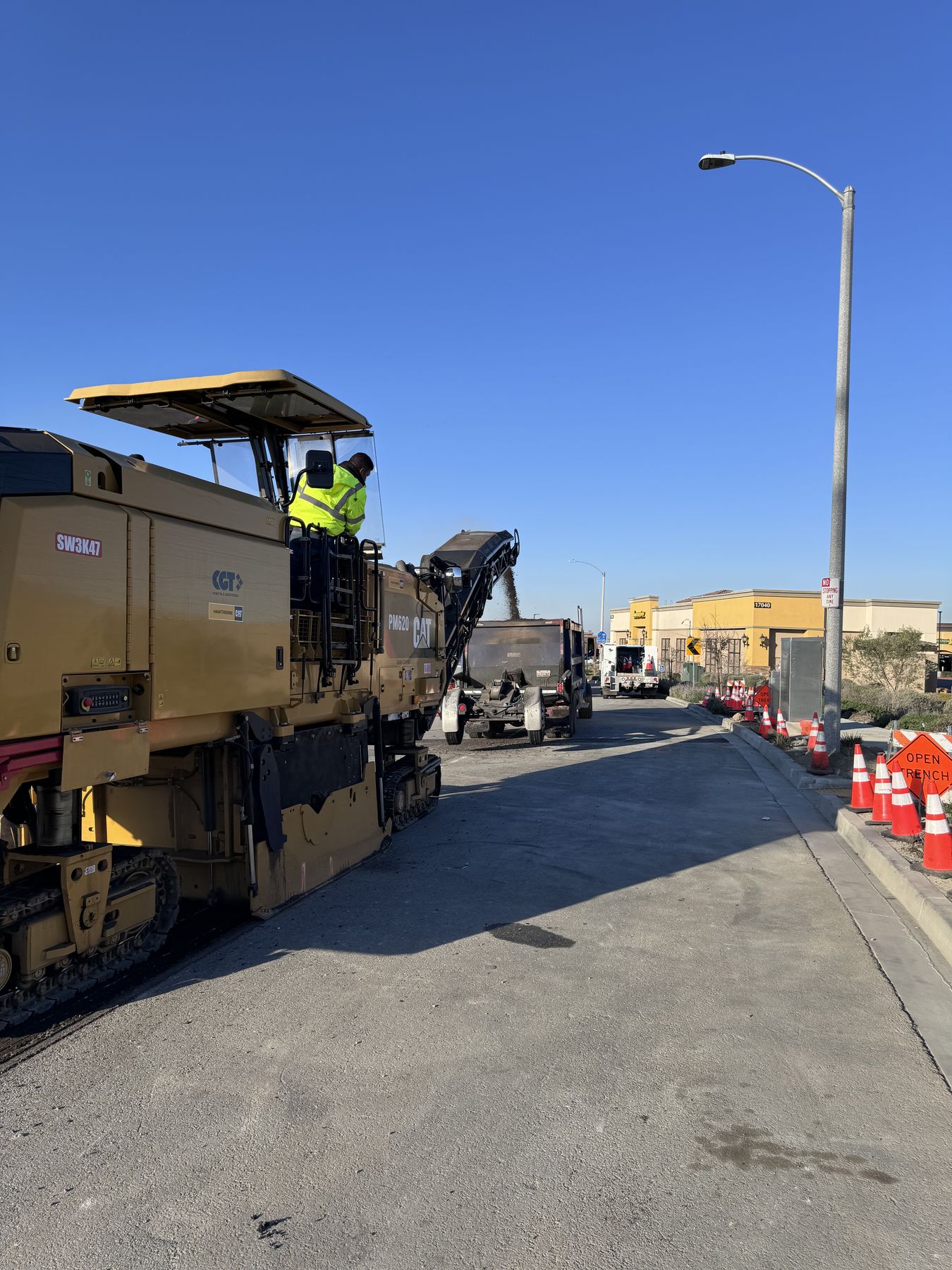 Cold planer milling a roadway