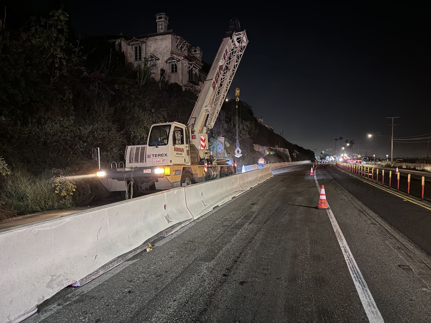 K-rail placement by crane on a highway project